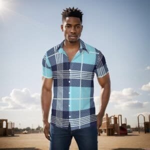 Home 5 Young man wearing a stylish plaid shirt outdoors on a sunny day.